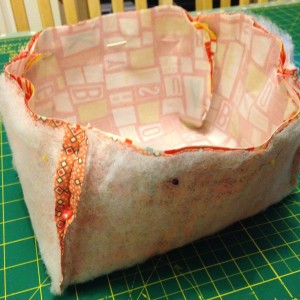 With shorter sides sewn together I placed them inside one another with the right sides of the fabric touching